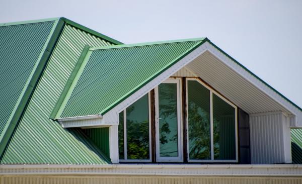 Attic-window-surrounded-by-green-Colorbond-roofing