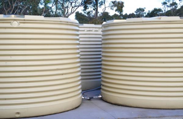 Three-large-cream-coloured-rainwater-tanks